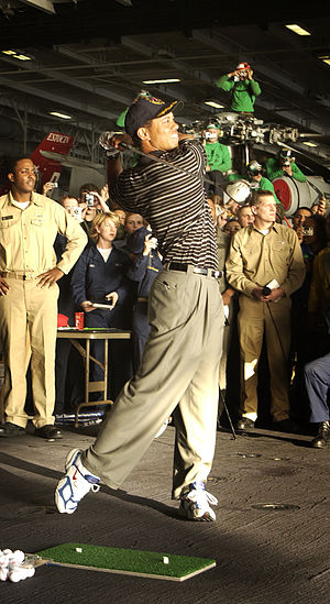 Tiger Woods giving a driving demonstration abo...