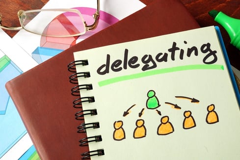 bigstock-Notebook-with-delegating-sign-109037285