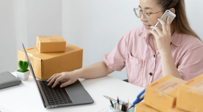 a worker looking on the computer for ways to streamline productivity 
