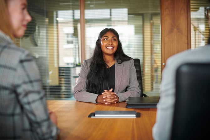 10:10 AMClaude responded: A confident manager sits at a conference table with hands clasped, listening attentively during a team meeting in a modern office setting.A confident manager sits at a conference table with hands clasped, listening attentively during a team meeting in a modern office setting.